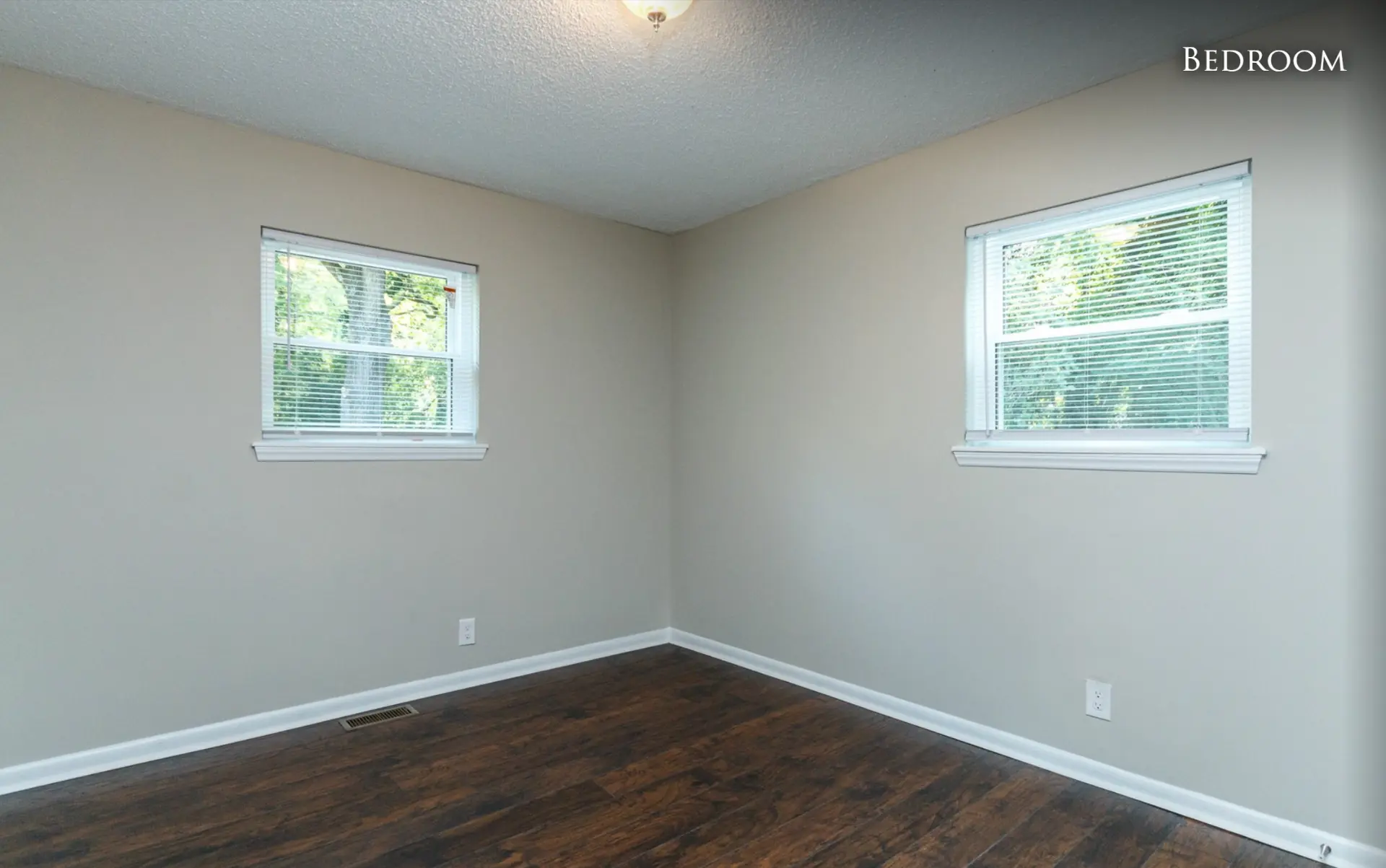 Unit A second bedroom with two windows