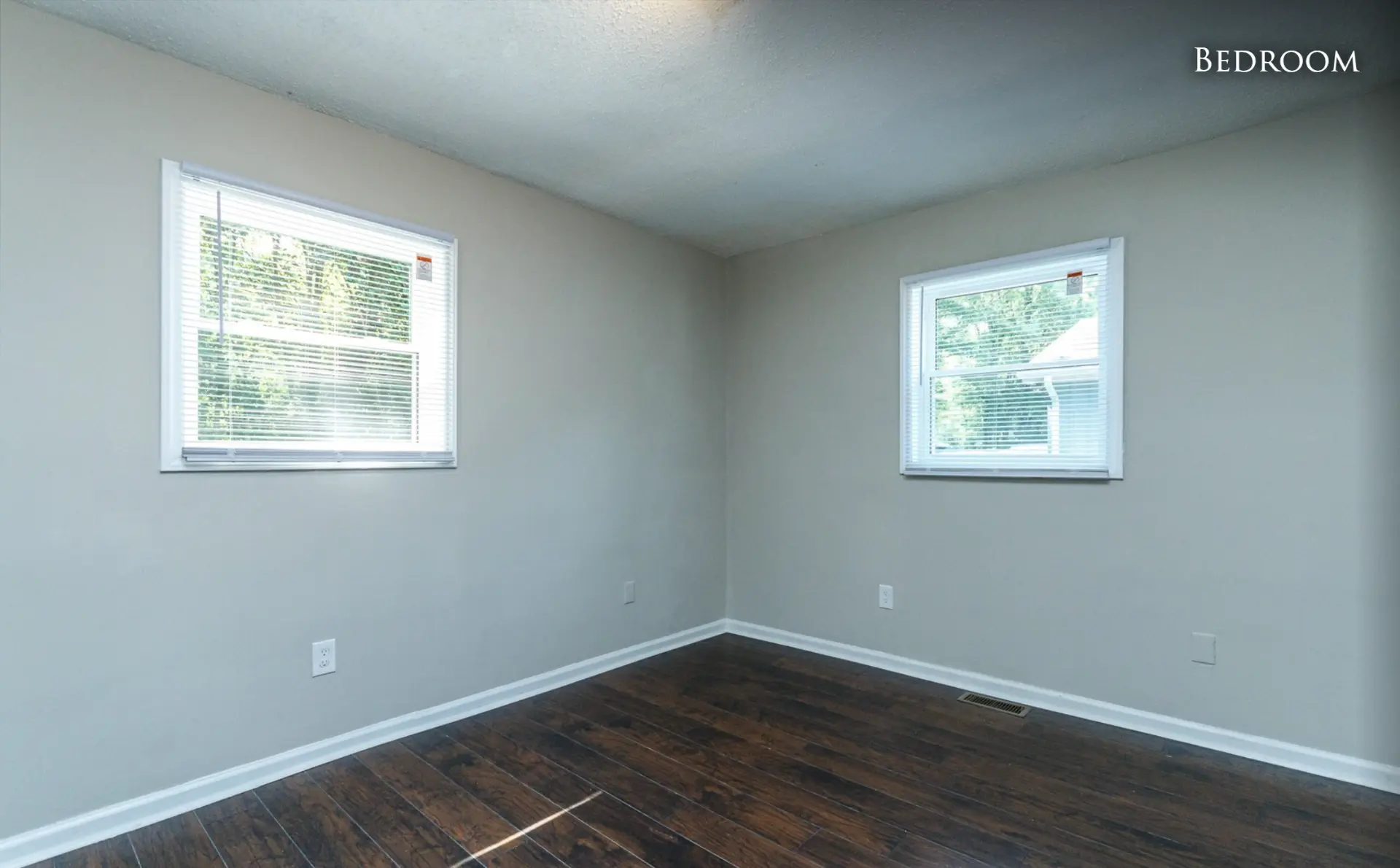 Unit B second bedroom with two windows
